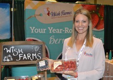 Amber Maloney with Wish Farms proudly shows blueberries and raspberries.
